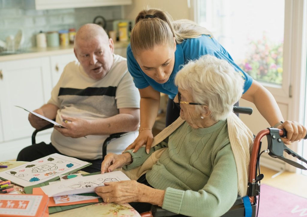 caregiver with elderly couple