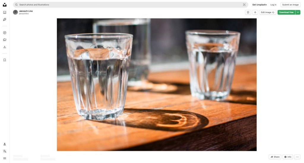 Glasses of water on a wooden table