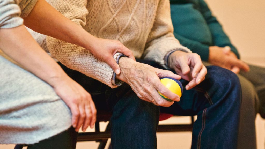 recognizing pain dementia caregiver comforting hand