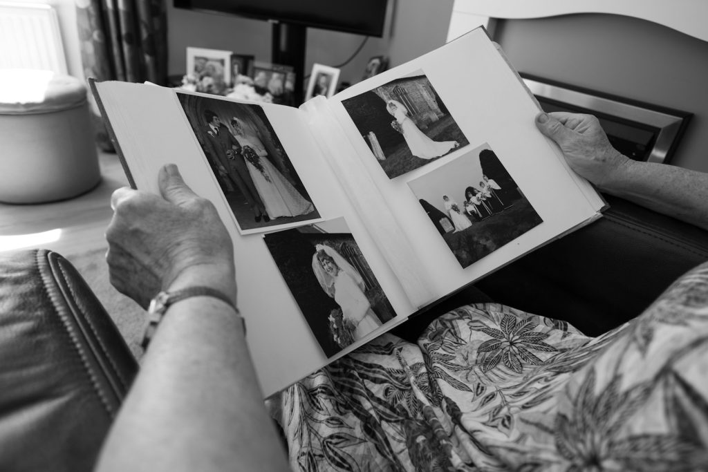 A grandchild and grandparent sharing music, helping children understand dementia