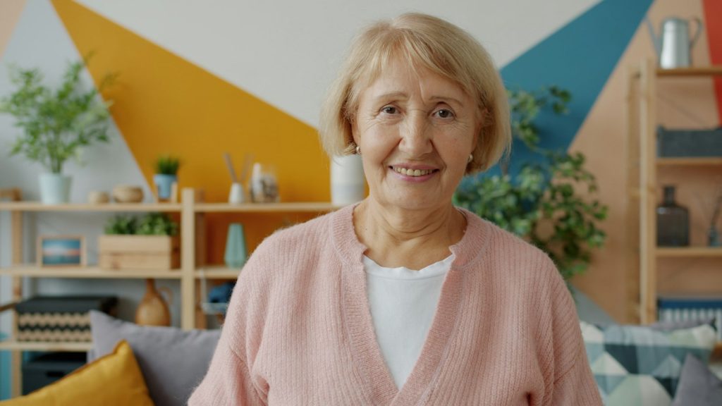 Long-distance caregiving: a woman on a video call with her older mother in Florida