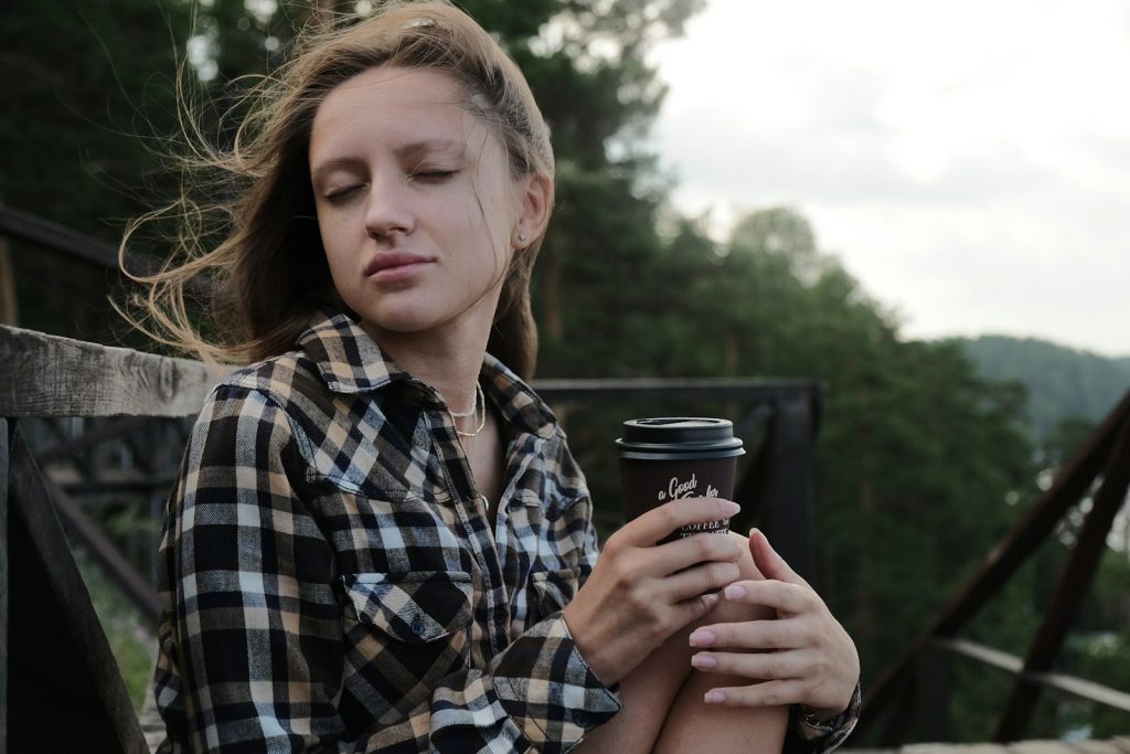Recovering from caregiver burnout: a woman walking outdoors while a companion stays with her mother