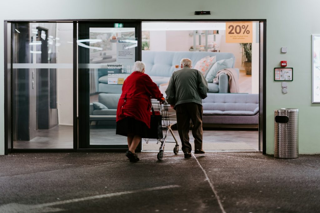Dementia companion care in action: a companion and an older woman doing a puzzle at the table
