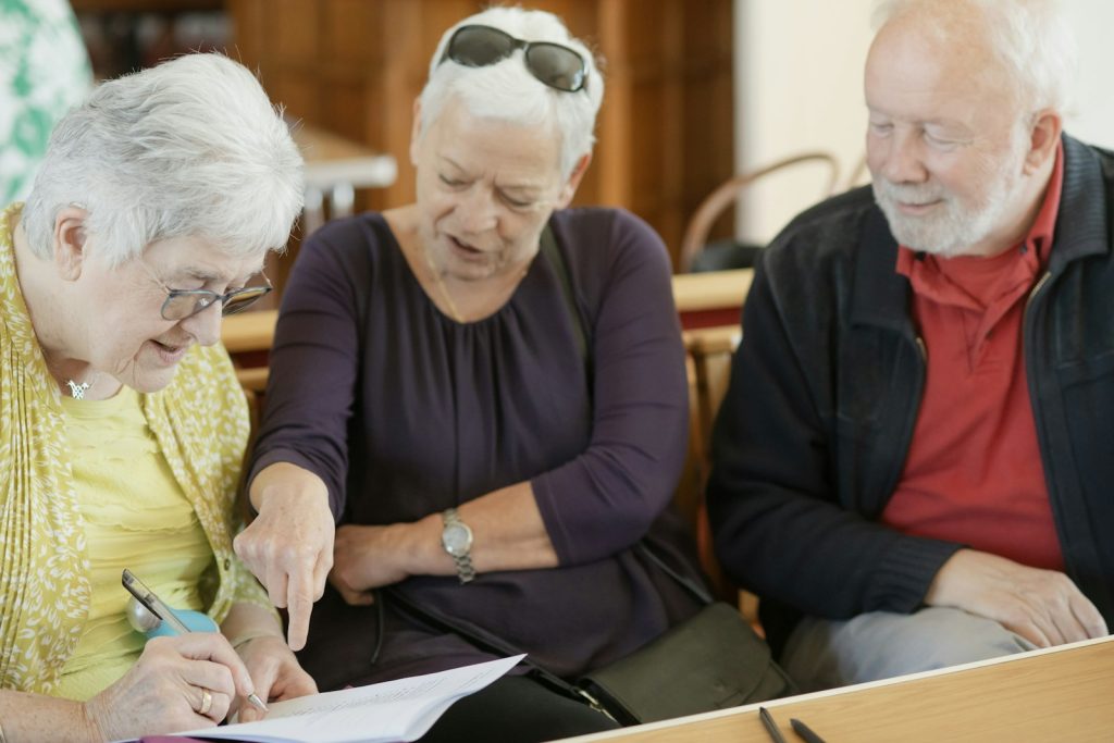 Planning a durable power of attorney: an adult son and his father going through paperwork