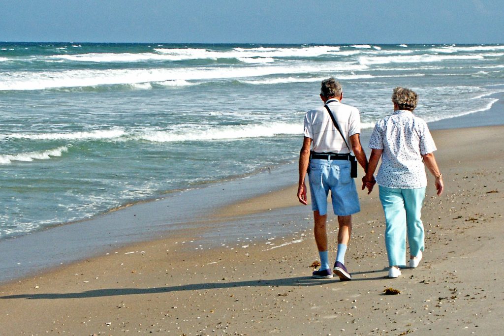Caring for frontotemporal dementia at home: a companion and a younger man working on a model together