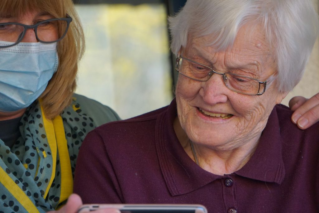 Home health care and companion care together: a therapist and companion helping an older woman walk