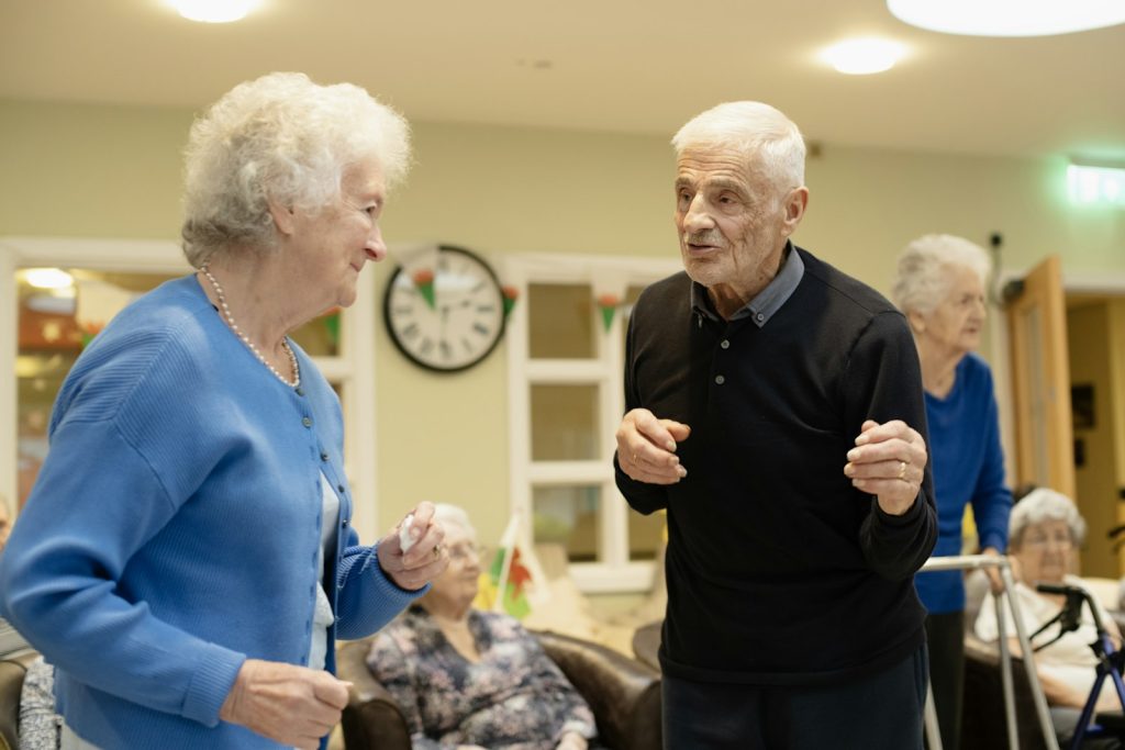 Touring memory care in Florida: an adult daughter and her mother visiting a bright common room