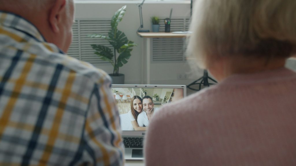 Palliative care at home: a nurse and daughter reviewing medicines with an older woman