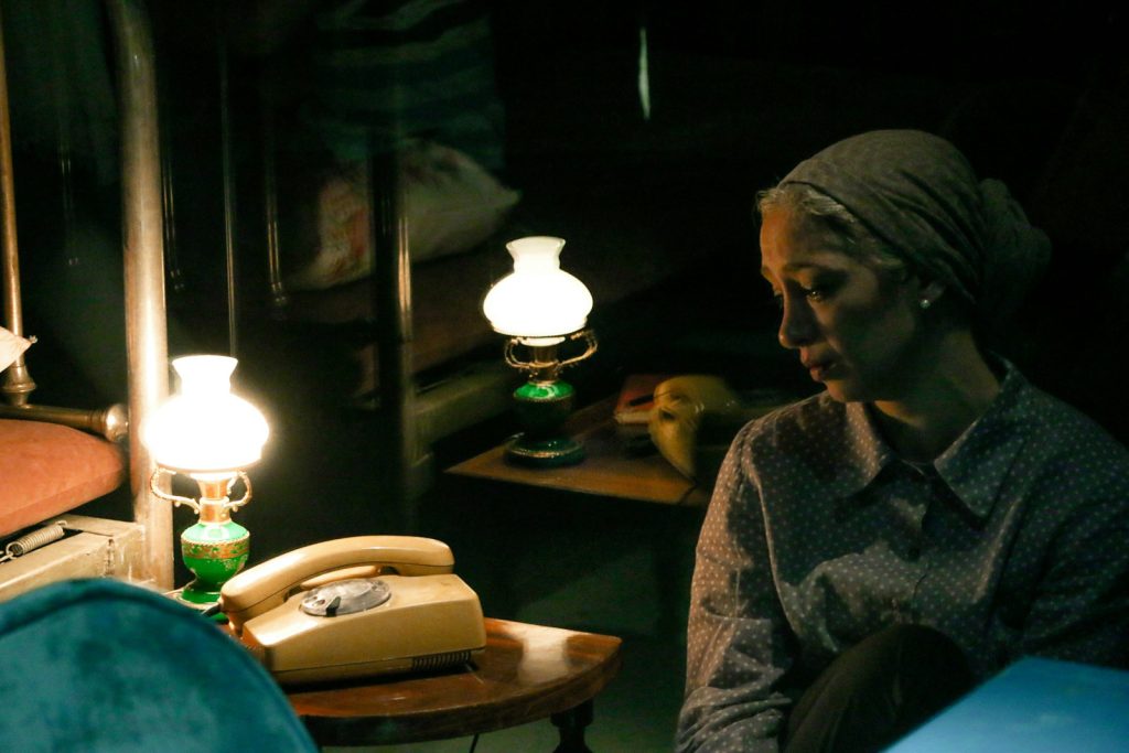 Easing sundowning with a calm evening routine: a caregiver and an older man listening to music at home