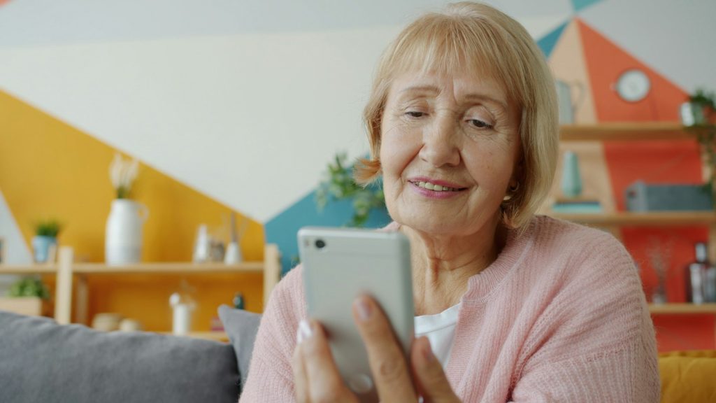 Finding Florida dementia resources: a daughter reviewing a list of local programs with her father