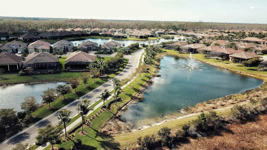 Companion providing dementia care in Fort Myers, playing cards with an older woman on a screened lanai