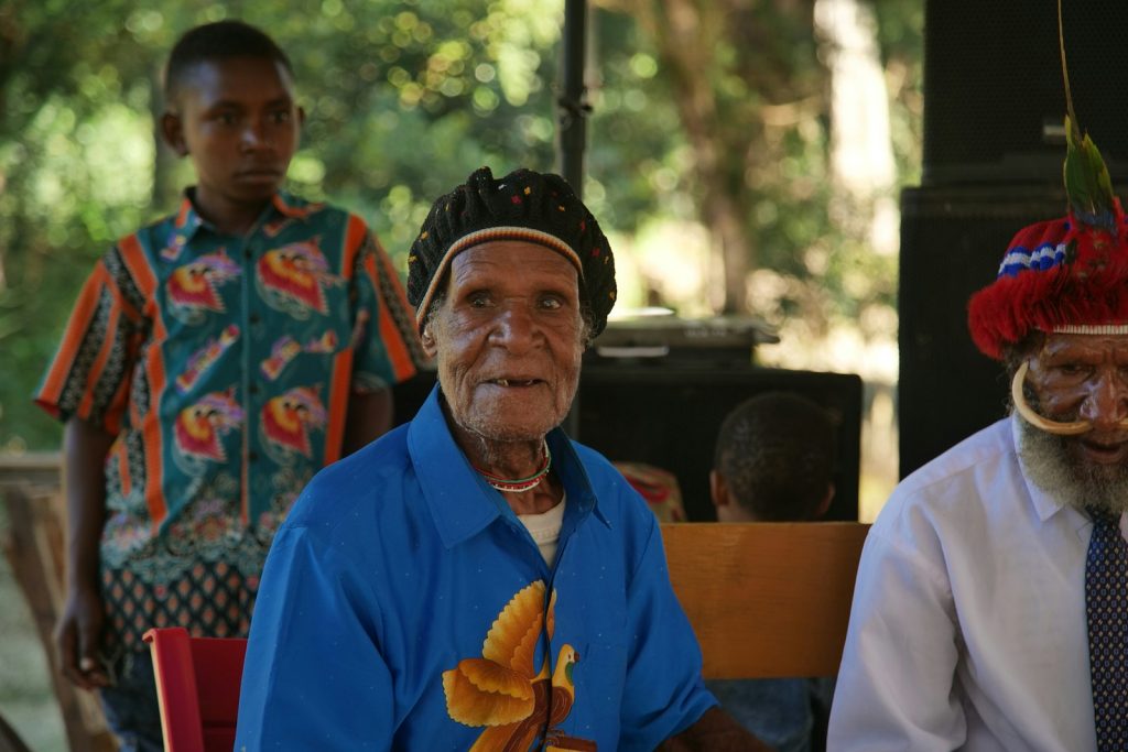 A companion providing dementia home care in Miami Gardens, sharing lunch and conversation at the kitchen table