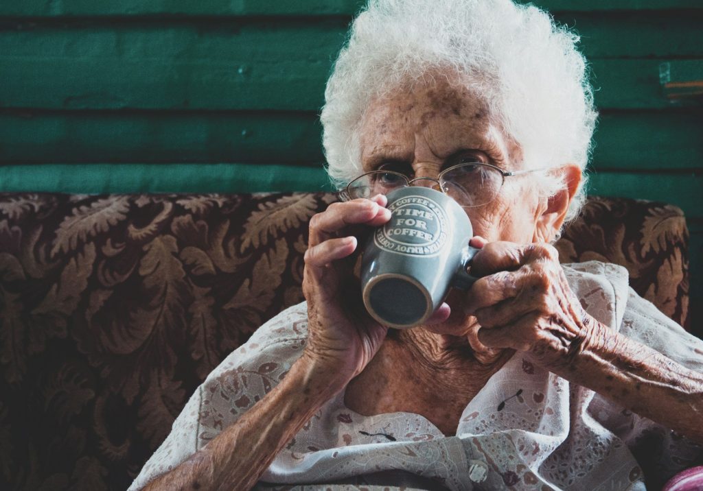 Dementia companion care in Florida: a companion and an older man walking in a sunny park