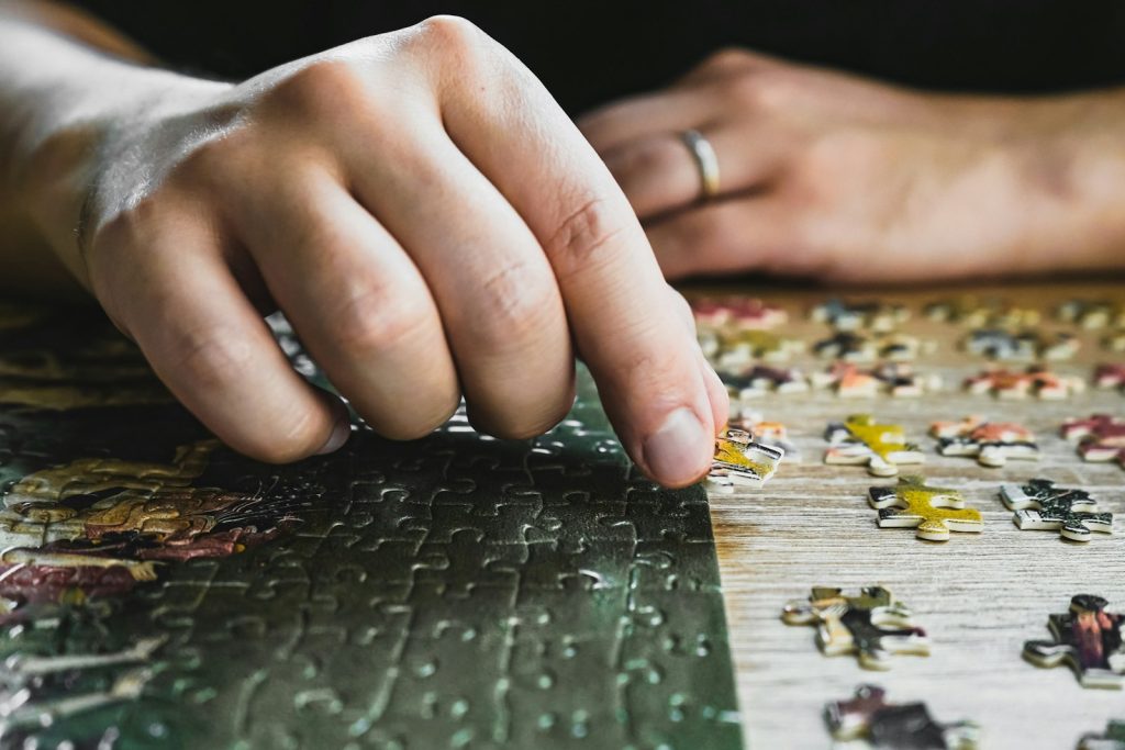 Memory engagement through crafts: a companion and an older woman arranging flowers at the table