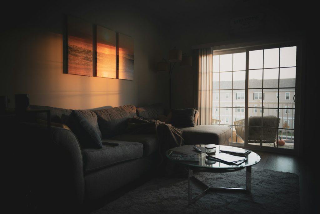 Sundowning in dementia: warm late-afternoon light through a living room window