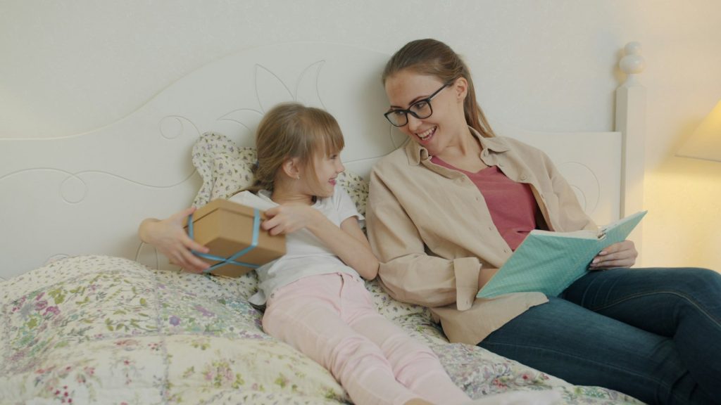 Using a dementia stage checker: a son and his older father talking with a family doctor